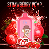 A pink RandM Digital Box 12000 vape device labeled "FUMOT" with a cartoon monkey logo, surrounded by strawberries and pomegranates, with the text "STRAWBERRY POMP" at the top.